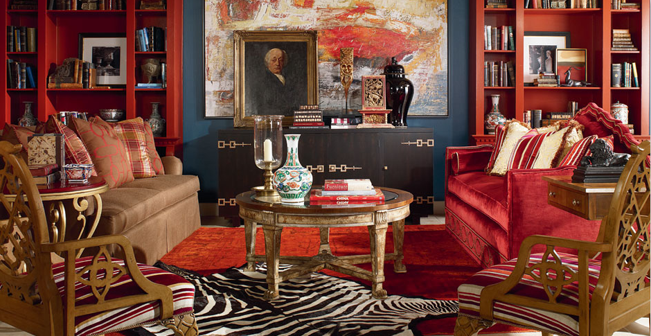 Red themed sitting room with down sofas