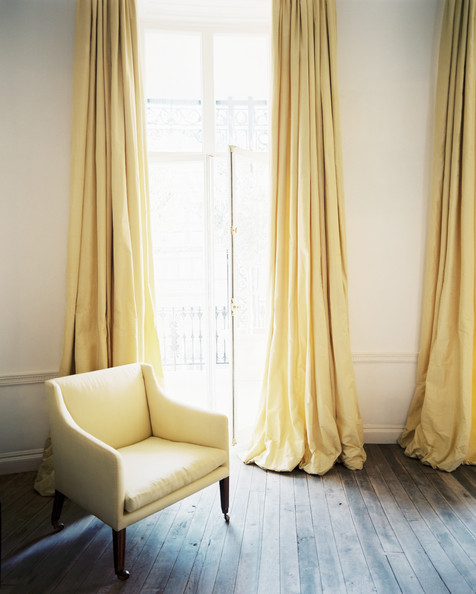 The best seat in the house is always near an open window—made even sunnier by the addition of buttercup drapery - Lonny mag