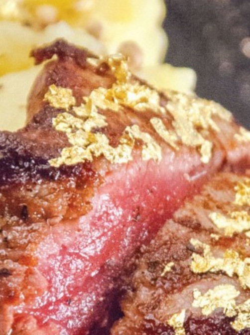 Steak with gold flakes photograph